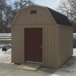 Madison Barn shed with Cedar Red Roll up door and ramp